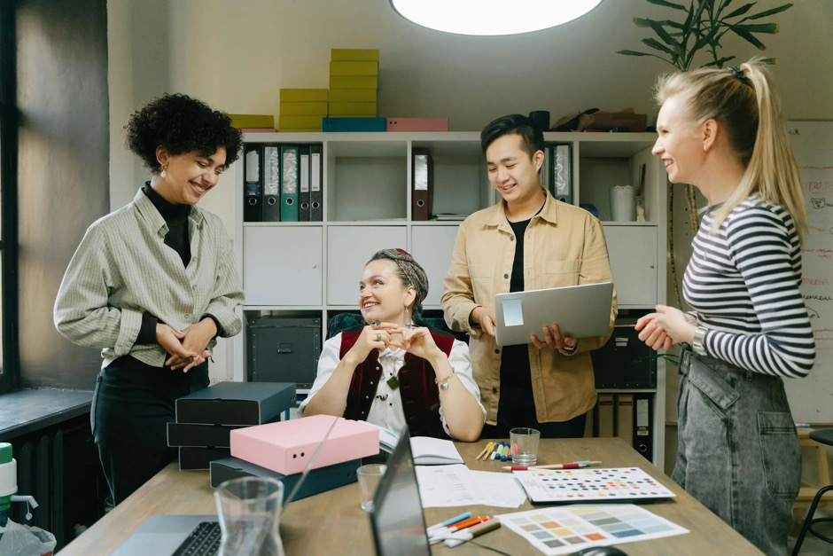 marketing team in a collaborative office space refining ad copy for a Google Ads campaign, focused on post-holiday shoppers.